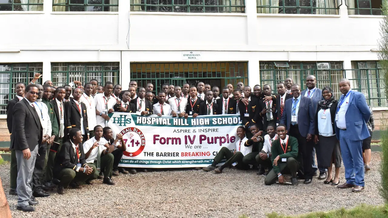 A Hospital Hill class group with their banner